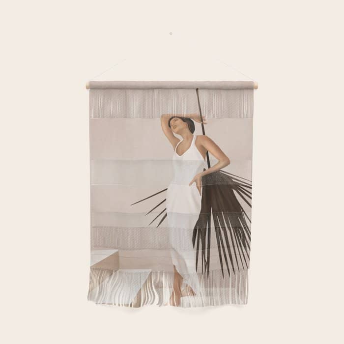 Minimal Woman With A Palm Leaf Wall Hanging