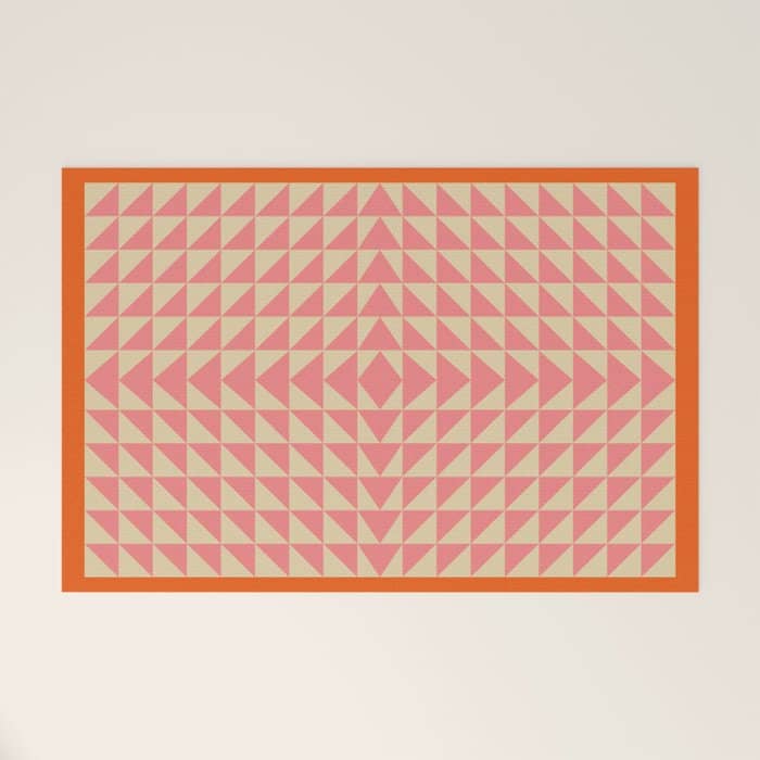 Bold Triangle Pattern In Pink And Orange Welcome Mat