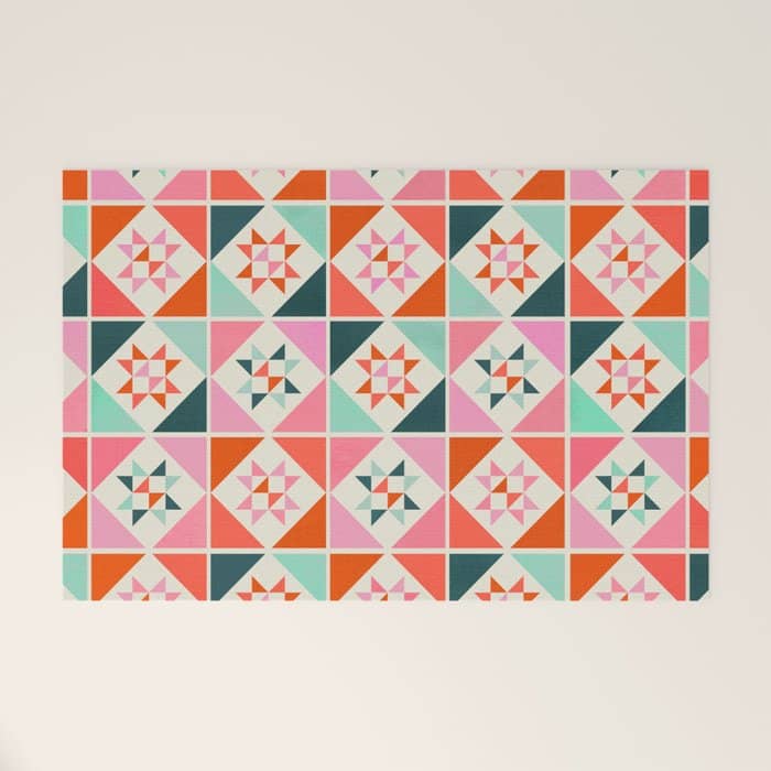 Festive Quilt Pattern In Pink, Red And Green Welcome Mat