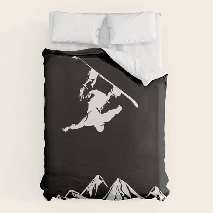 Rocky Mountain Snowboarder Catching Air Duvet Cover