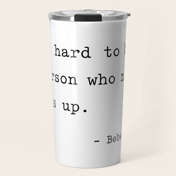 It Is Hard To Beat A Person Who Never Gives Up Travel Mug
