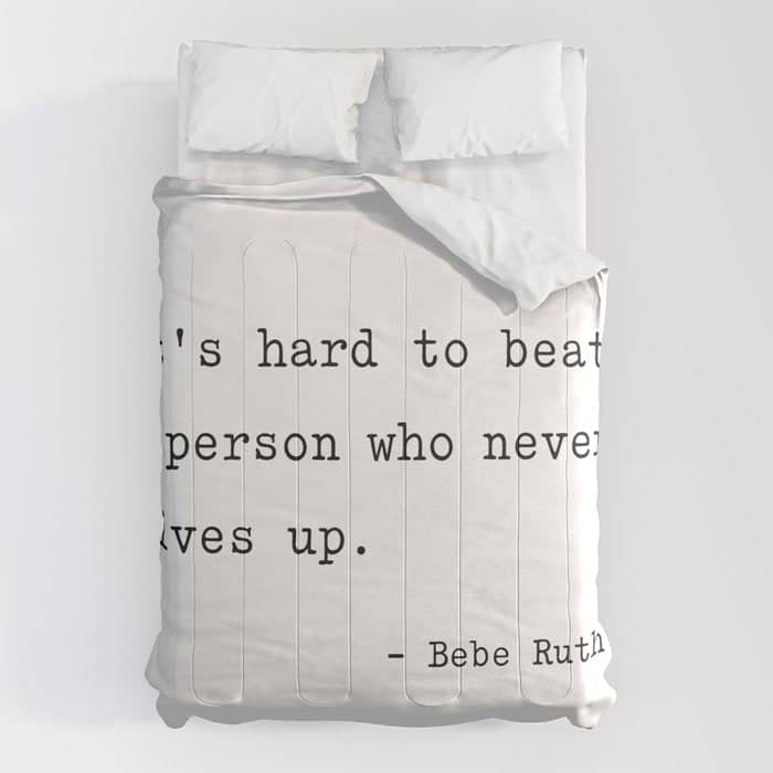 It Is Hard To Beat A Person Who Never Gives Up Comforter
