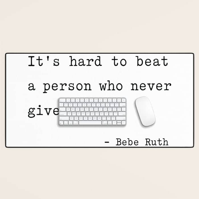 It Is Hard To Beat A Person Who Never Gives Up Desk Mat