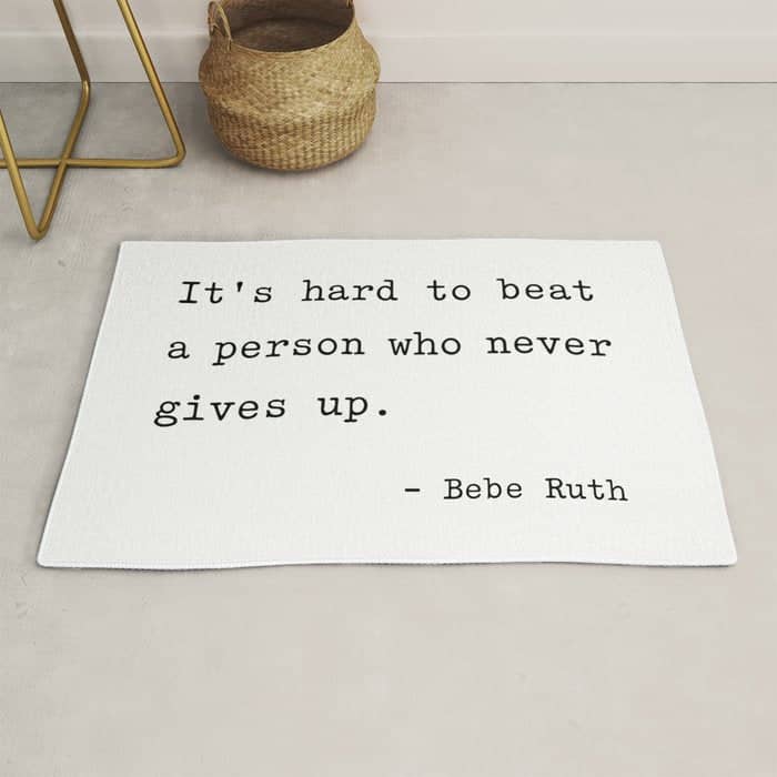 It Is Hard To Beat A Person Who Never Gives Up Rug