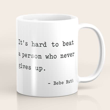 It Is Hard To Beat A Person Who Never Gives Up Coffee Mug