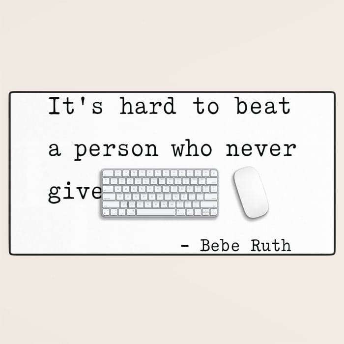 It is hard to beat a person who never gives up Desk Mat