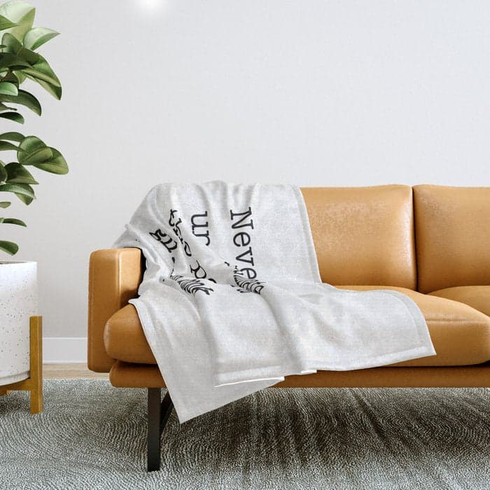 Never underestimate the power of a girl with a book. Throw Blanket